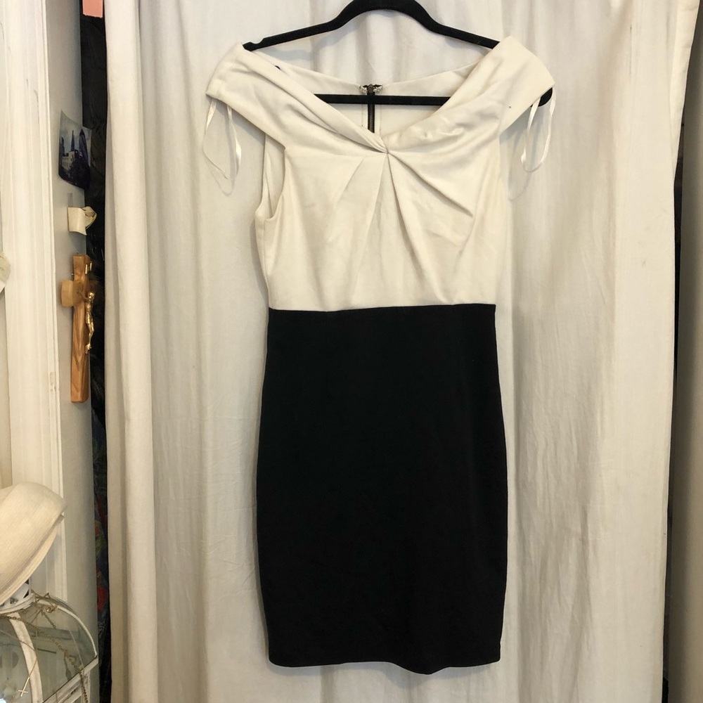 Black and white off the shoulder body con dress.